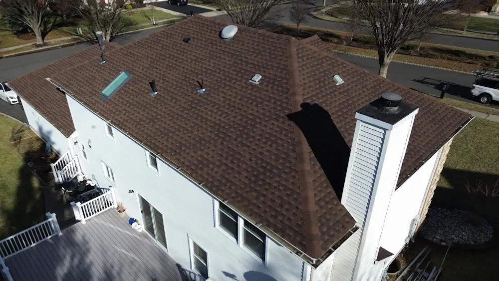 Aerial view of custom gray deck design and installation showing spacious layout by Double D Construction